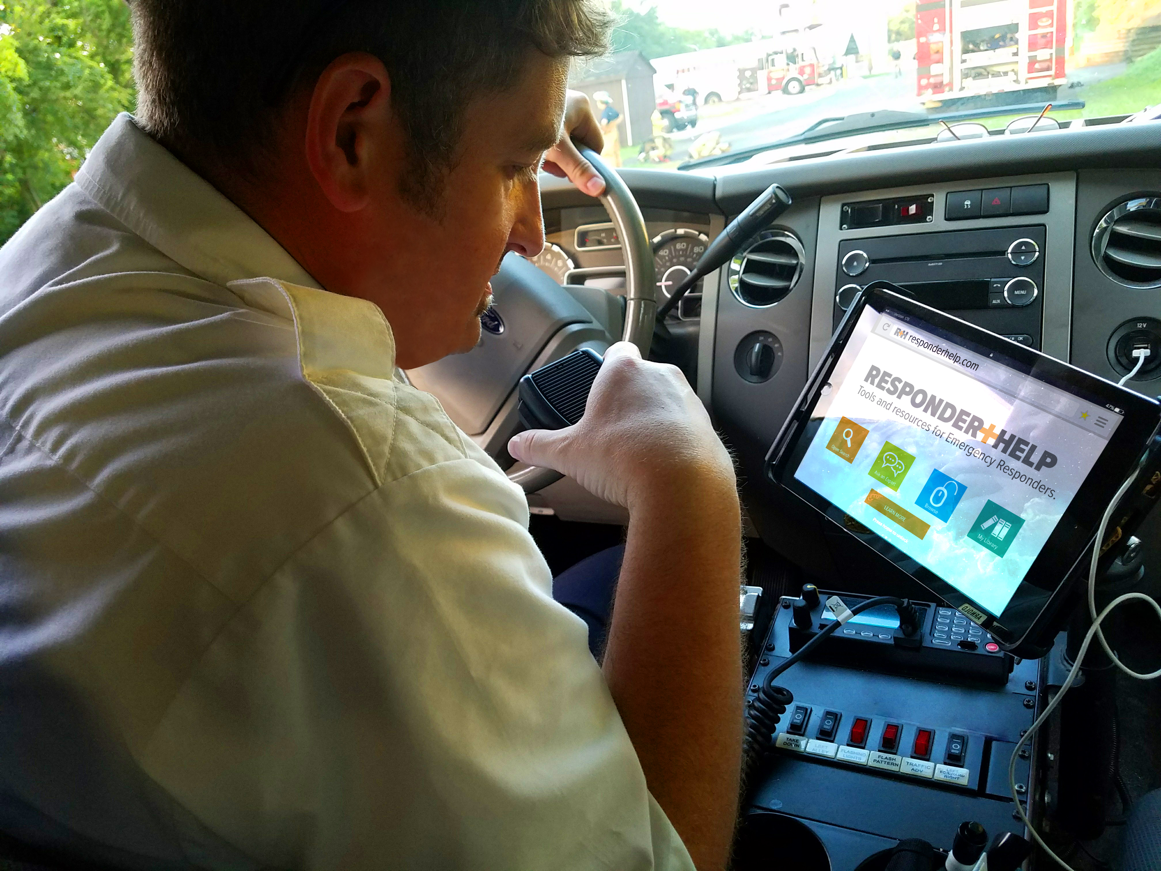 Captain using iPad to access online resources on ResponderHelp