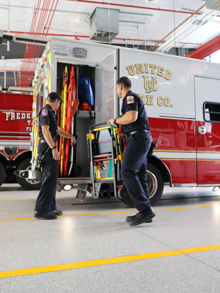 EMS Members unloading equipment from an ambulance